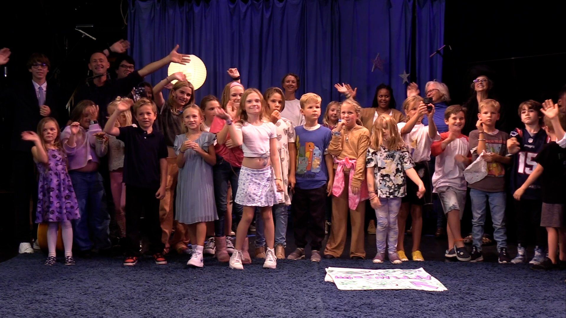 The Diamond Show cast waving from the stage